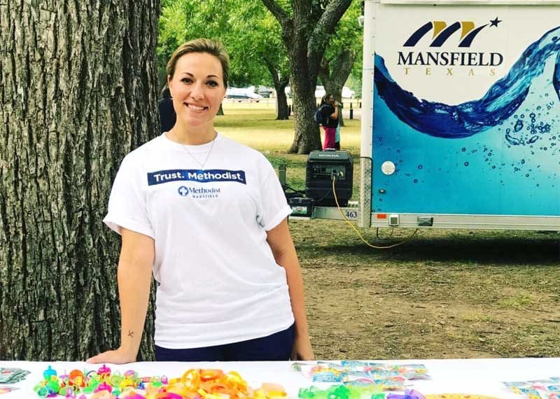 Anna Robbins represents Methodist Health System and raises drowning prevention awareness at Rose Park in Mansfield.