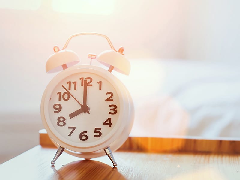 Alarm clock on bedside table