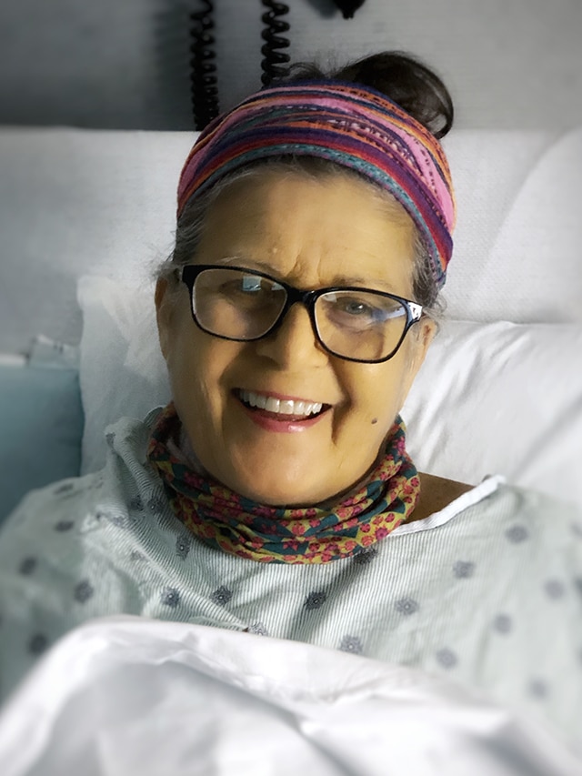 barbara winn smiling at camera in the hospital after transplant