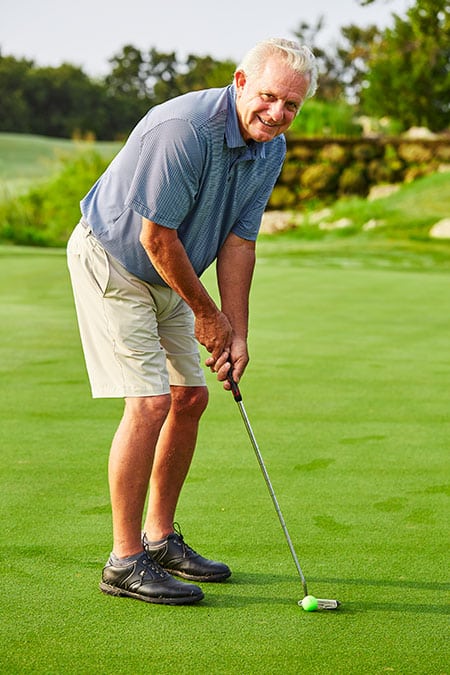 Johnny Colley golfing after his recovery from a gallbladder condition 