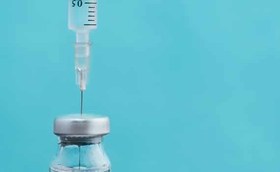 Stock image of a syringe used to express the importance of the flu shot and COVID-19 awareness