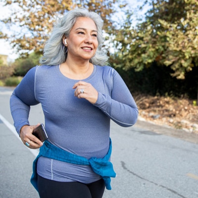 Woman on a jog, promoting self-care during the pandemic