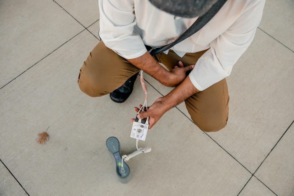 Bhargava Kotapalli, a brain cancer patient, demonstrates his Optune device's capability