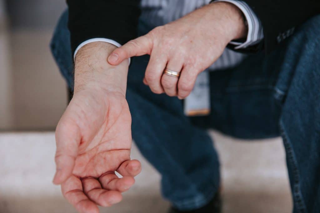 Chuck Roe pointing to his wrist where a stent was added