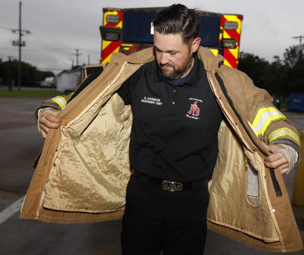 Alvarado fireman Doug Johnson showing off his "fat jacket" from before bariatric surgery