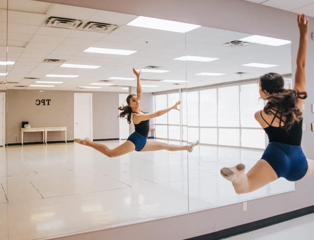 Chloe practicing dance in a studio