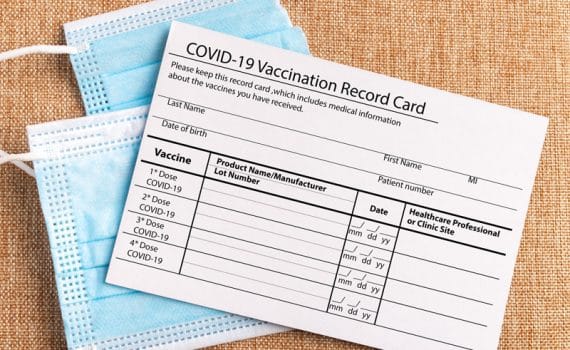 COVID-19 vaccine card with a mask