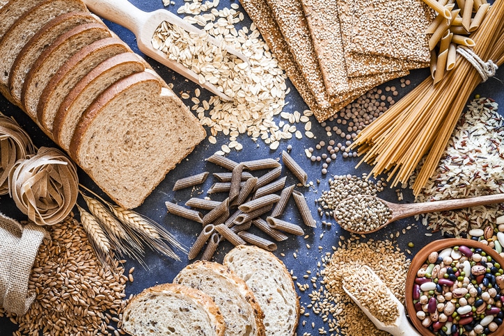 An array of whole grains, breads, legumes and pastas