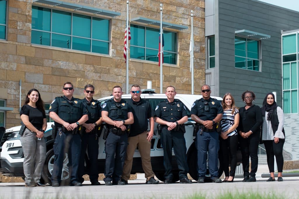 Methodist Richardson Medical Center staff and police photographed together to celebrate the creation of a joint crisis team for mental health