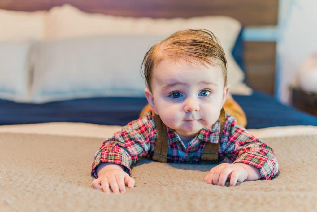 John Smith, a baby born at the Methodist Midlothian labor and delivery department, crawling on a bed