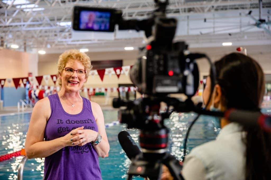 Erika Burkhardt being interviewed after surviving breast cancer