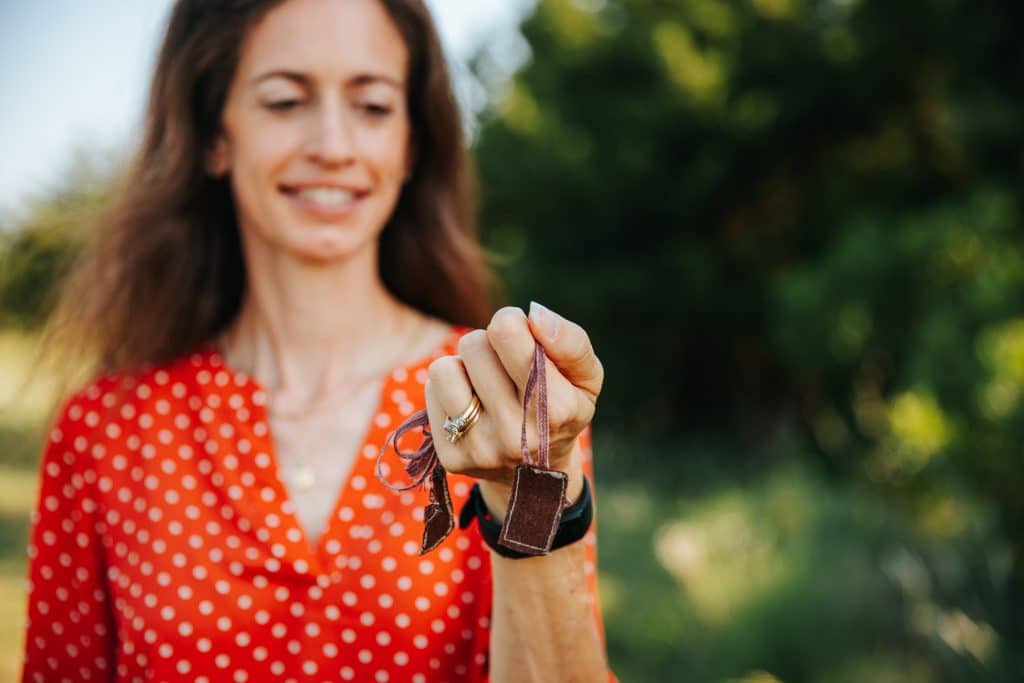 Melanie Proffitt holding a family talisman