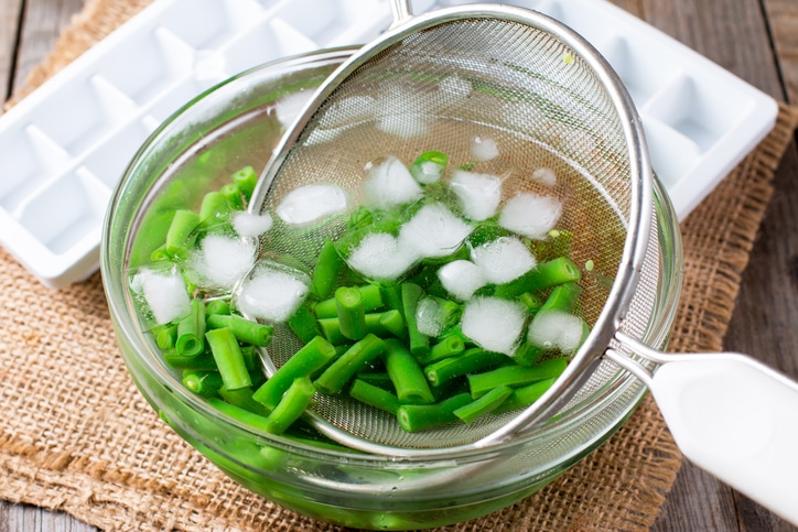 Green beans going into an ice bath