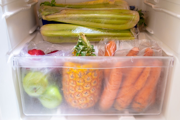 Produce in the produce drawer, such as carrots and apples and pineapples