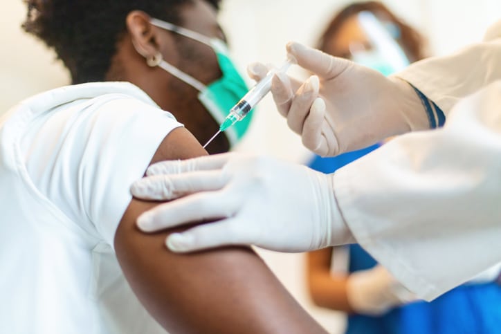 A medical professional administering a vaccine