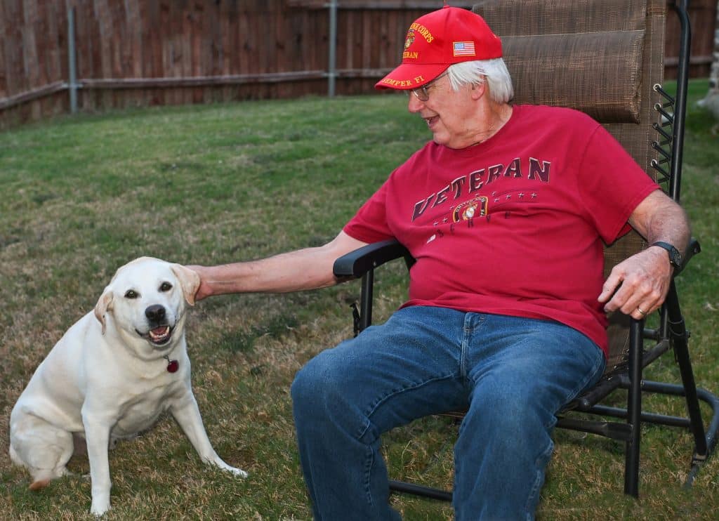 Robert "Steve" Moon photographed with his dog