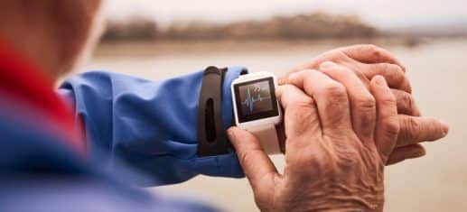 Person looking at their health tracking smartwatch, used to explain A-fib and arrhythmia