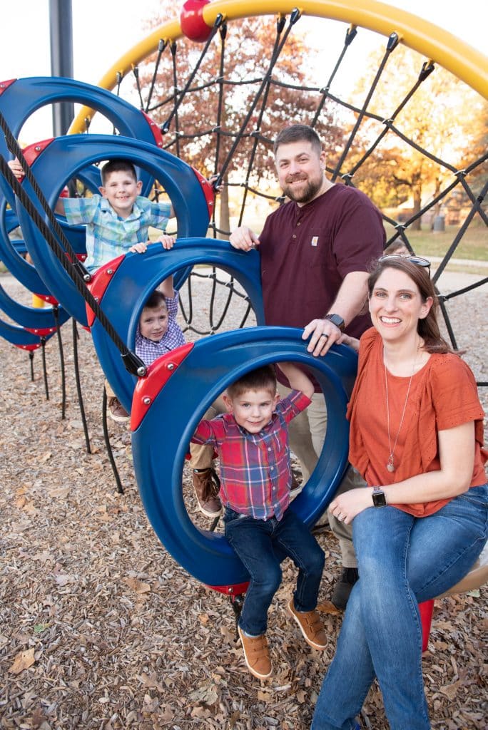 Jason and Kelli Taylor photographed with their sons at a park