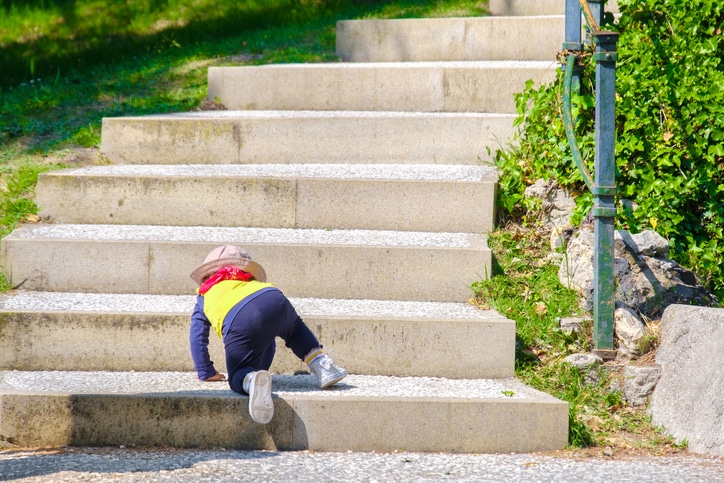 A child climbing up stairs