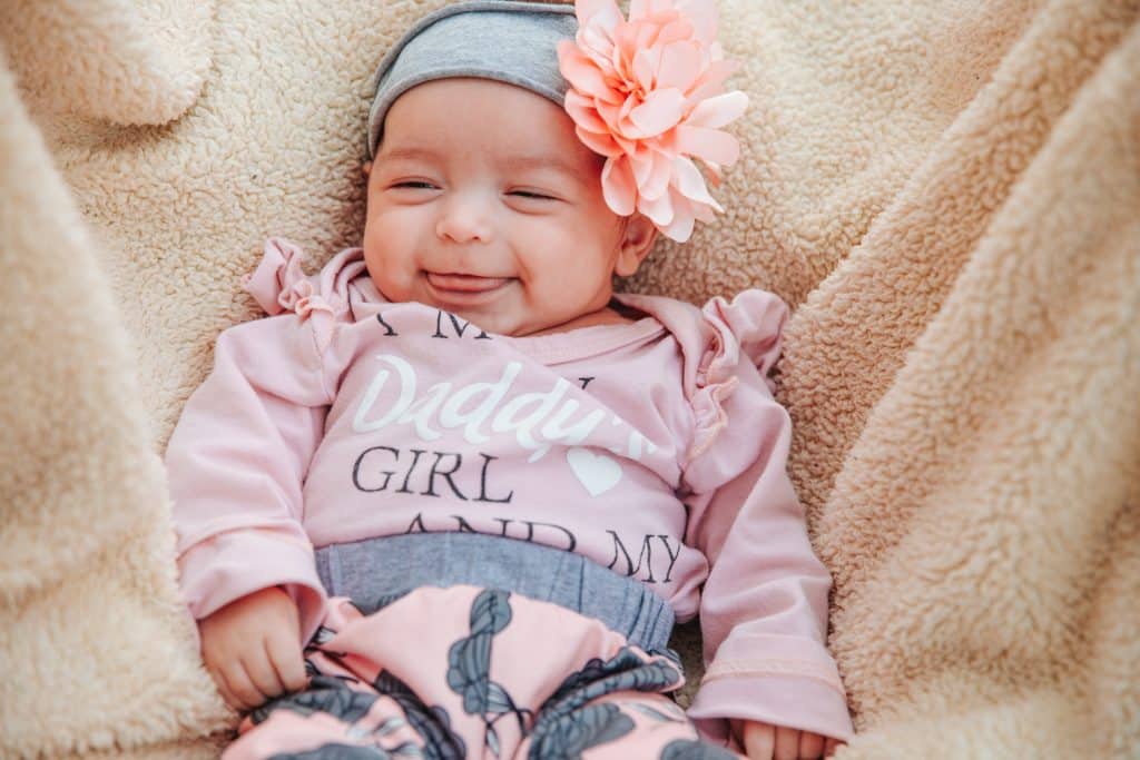 Baby Natalia smiling after her NICU stay