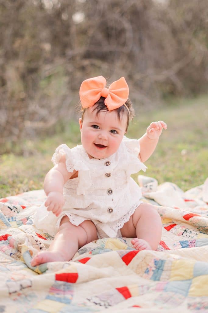 Child Chloe May looking at the camera and smiling