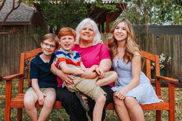 Cyndia Moore with her grandchildren (from left) Holden, Harrison, and Laci