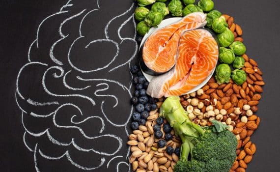 Stock image of food and a chalk outline of a brain, used to explain the MIND diet plan for the brain