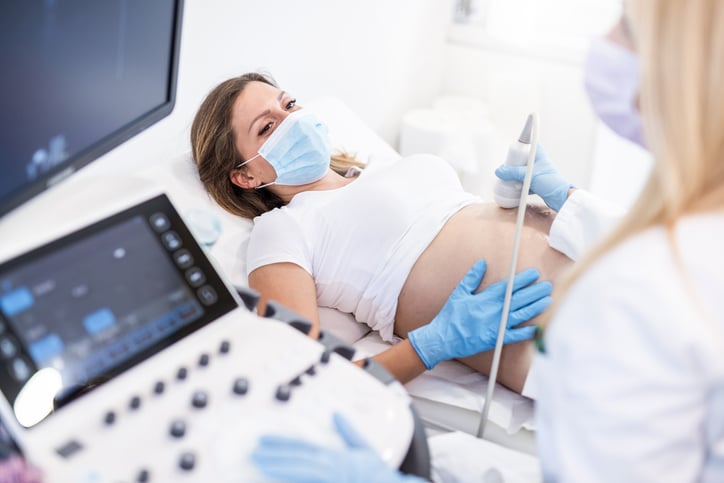A woman receiving an ultrasound during pregnancy