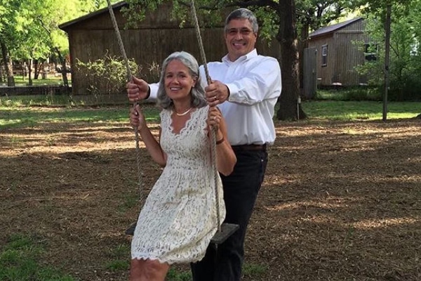 Lynda Russell on a swing photographed with her husband Anthony