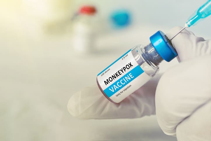 Stock image of a vaccine being pulled from a vial with the words monkeypox vaccine" on the front