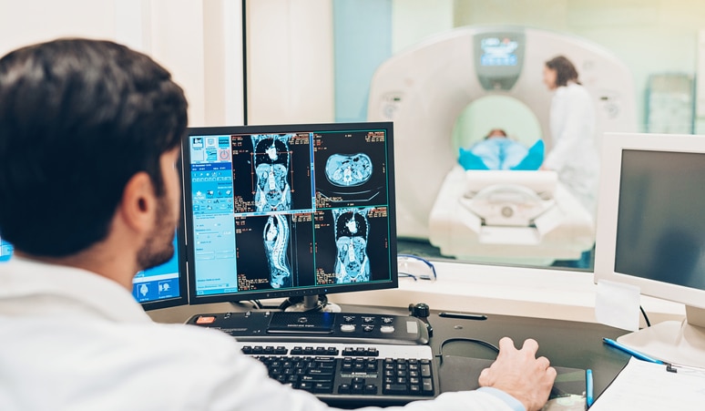 Image of a technologist and radiologist performing an imaging scan