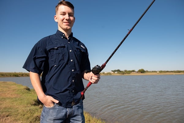 Garrett Blackmon photographed with a fishing pole