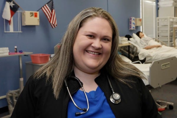 Midlothian educator Megan Lynch smiling at the camera after being treated for vertigo