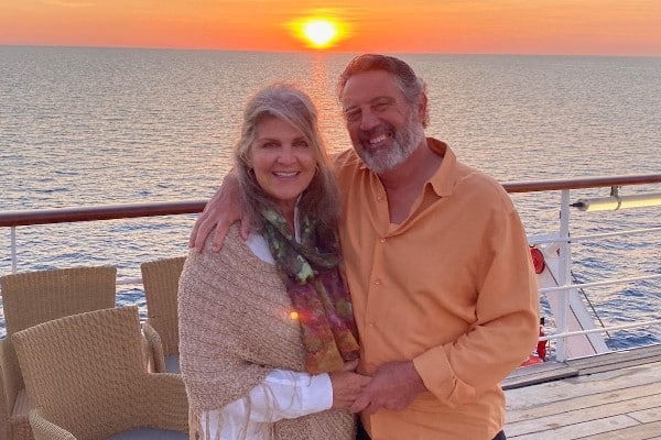 Gwen and Mike Rand on vacation after their surgeries, photographed on a boat with the ocean in the background