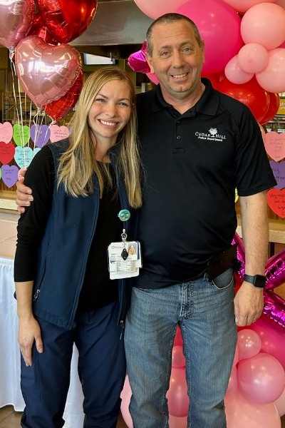 Army Staff Sgt. Jim Valenti and smiling at the camera with Annie Caussey, RN