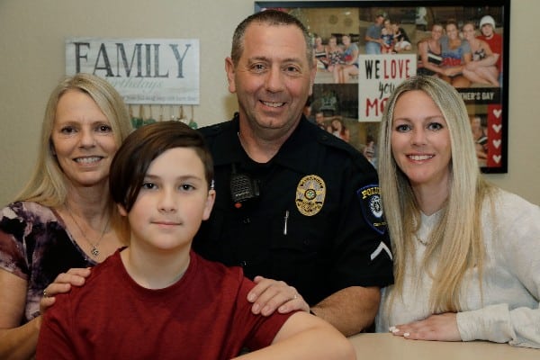 Army Staff Sgt. Jim Valenti photographed with his wife Madonna, their daughter, and her son