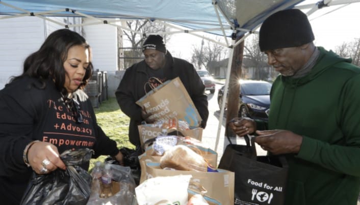 Tammy and Leonard hold a food drive for the nonprofit Empowering the Masses.