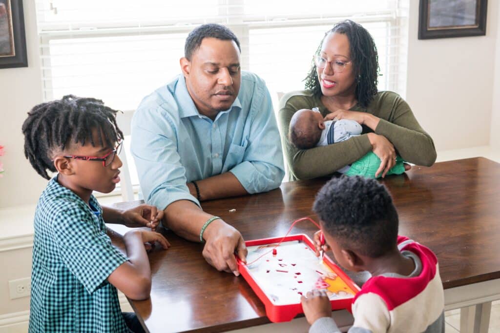 Nyadia Thorpe with her newborn, Caris, husband, Jeff, and sons Caden, 10, and Caius, 4