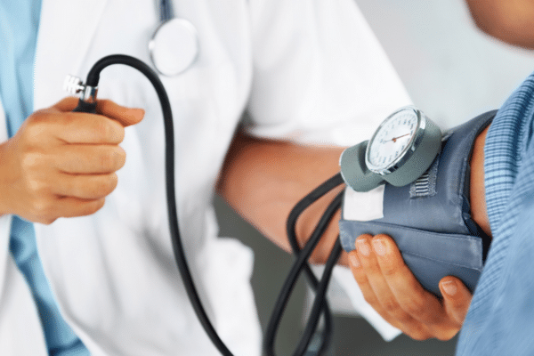 A medical professional performing a blood pressure test