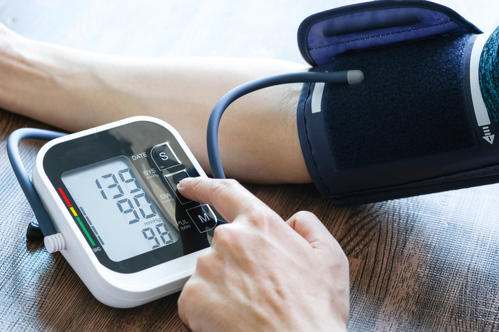 A person measuring their blood pressure