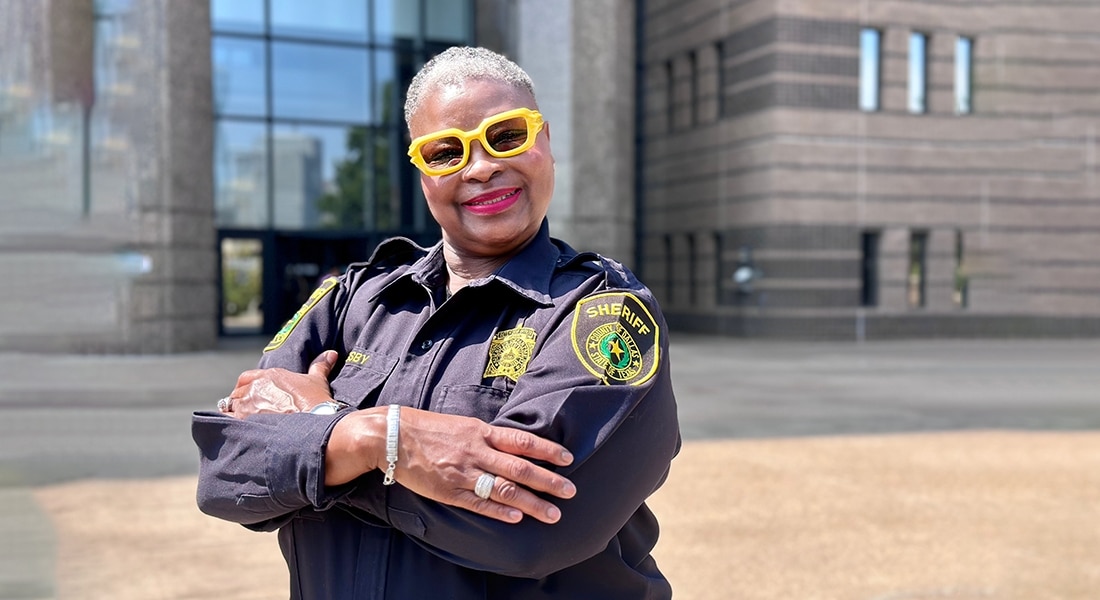 Dallas County correctional officer Wanda Grigsby photographed smiling at the camera after overcoming endometrial cancer