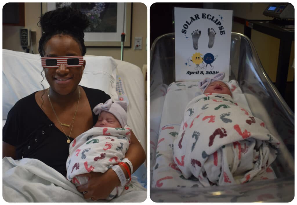 On the left, a woman wearing solar eclipse viewing glasses cradles an infant in a darkened room. On the right, an infant lies in a bassinet. Behind the baby is a sign reading "Solar Eclipse" and showing a pair of baby footprints.