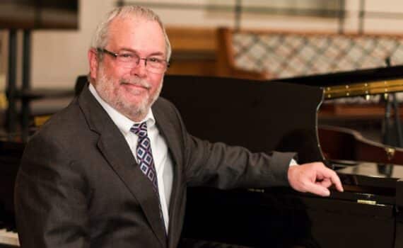 Cancer survivor Paul King plays piano at his DeSoto church