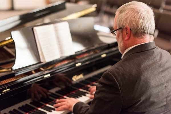 Paul King playing piano