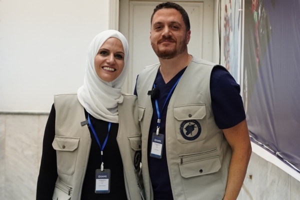 Dr. Alomar and his wife, Sawsan, photographed together with matching beige vests