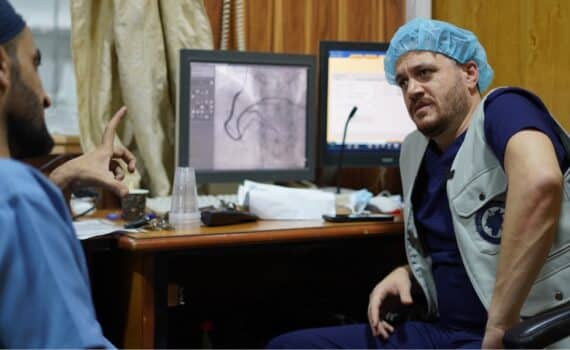 Anas Alomar, MD, in a medical office in Syria to help refugees with medical care