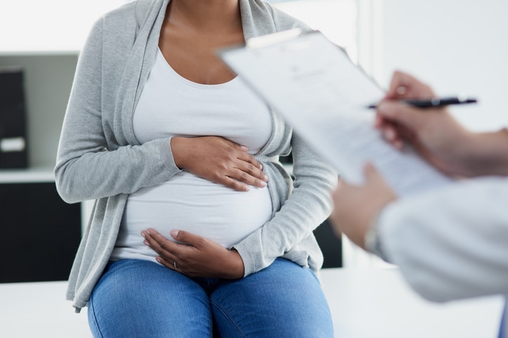 Shot of an unrecognizable female doctor consulting with a pregnant patient at a hospital during the day