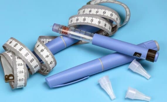 Image of injectable weight loss drugs with a measuring tape