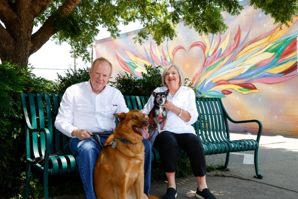 Heart attack survivor Leon Mullins takes a break with his wife, Susan, and their dogs.