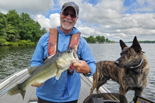 Troy Guidry and his dog out fishing on Joe Pool Lake